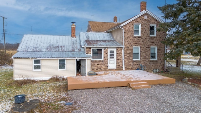 rear view of property with a deck