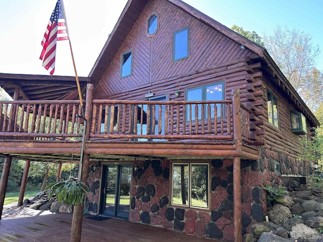 rear view of property with a deck