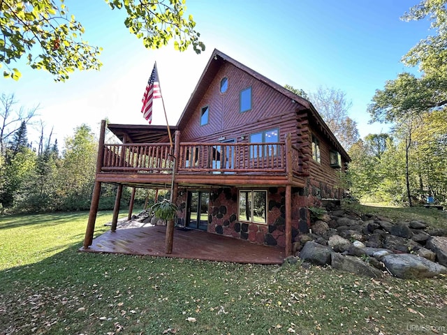 rear view of property with a lawn, a patio area, and a deck