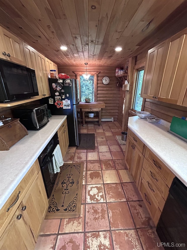 kitchen with rustic walls, a healthy amount of sunlight, light brown cabinetry, and hanging light fixtures