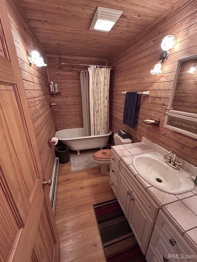 full bathroom featuring toilet, wooden ceiling, and wood walls