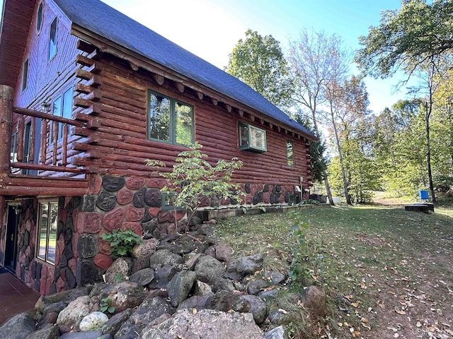 view of home's exterior with a lawn