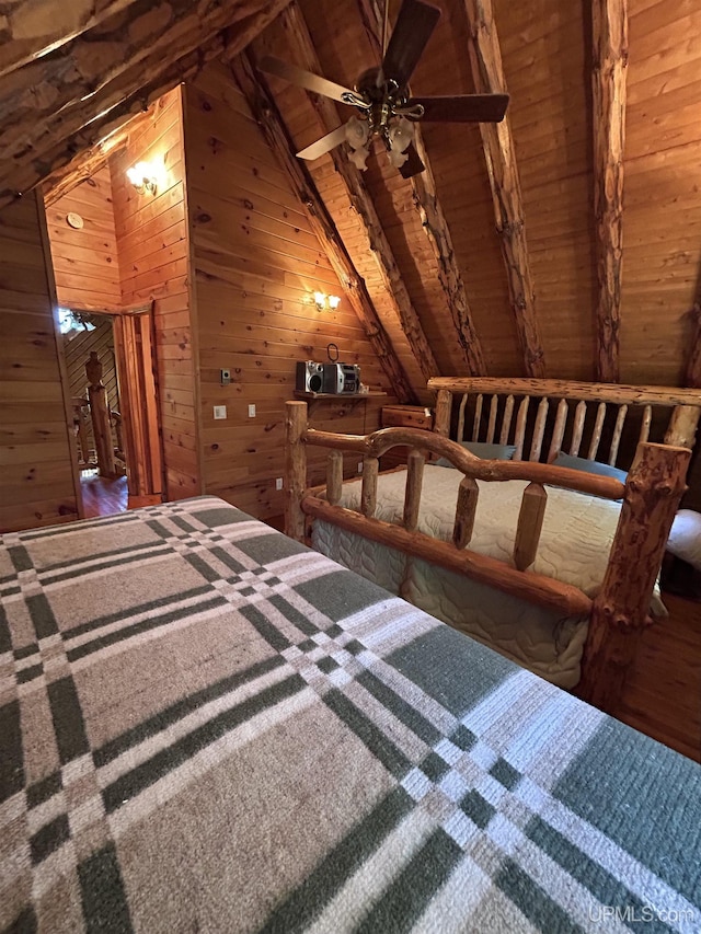 unfurnished bedroom featuring ceiling fan, lofted ceiling with beams, wooden ceiling, carpet floors, and wood walls