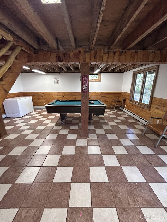 rec room with wood walls, a baseboard radiator, and billiards