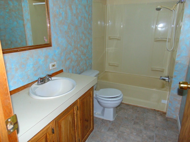 full bathroom featuring vanity,  shower combination, and toilet