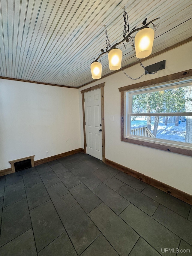 interior space featuring wood ceiling and ornamental molding