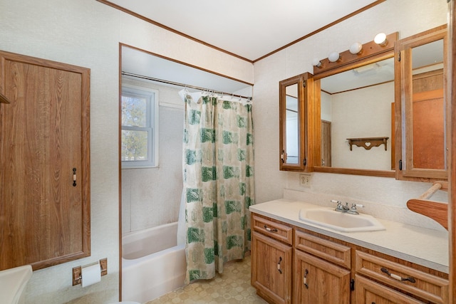 bathroom featuring crown molding, vanity, and shower / tub combo