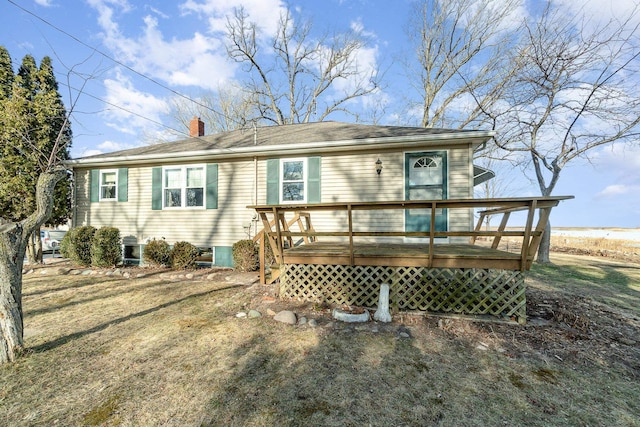 back of property with a wooden deck