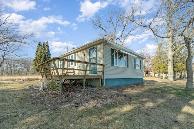 view of side of home featuring a wooden deck