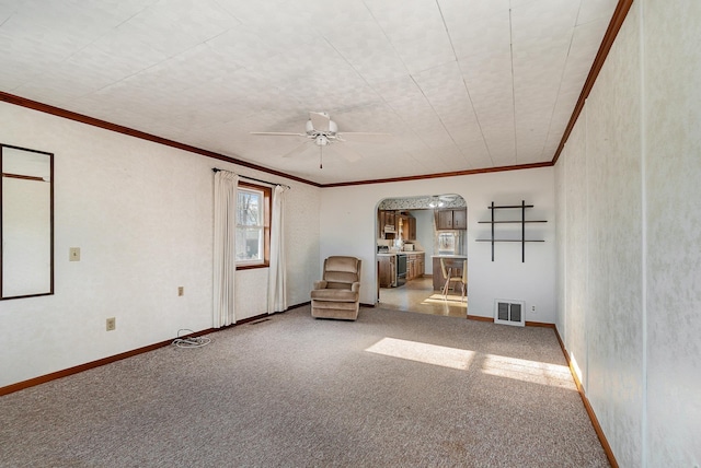 unfurnished room with ceiling fan, carpet floors, and ornamental molding