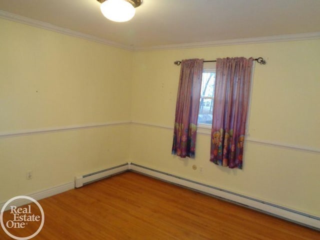 unfurnished room featuring wood-type flooring, ornamental molding, and a baseboard radiator