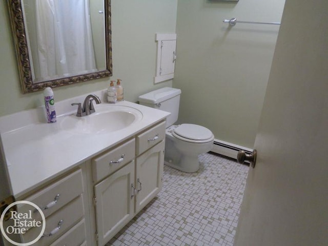 bathroom with tile patterned flooring, vanity, toilet, and baseboard heating