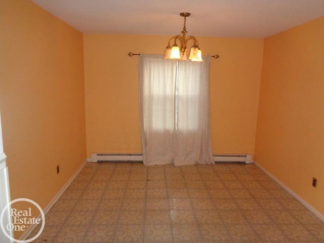 spare room with baseboard heating and a notable chandelier