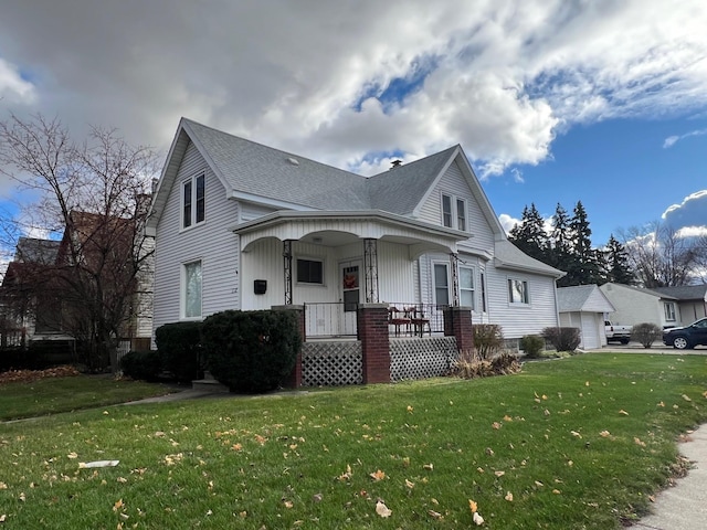 view of front of house with a front lawn and covered porch