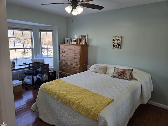 bedroom featuring ceiling fan and dark wood-type flooring