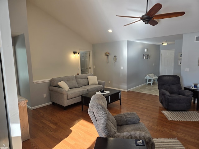 living room featuring vaulted ceiling, ceiling fan, and dark wood-type flooring