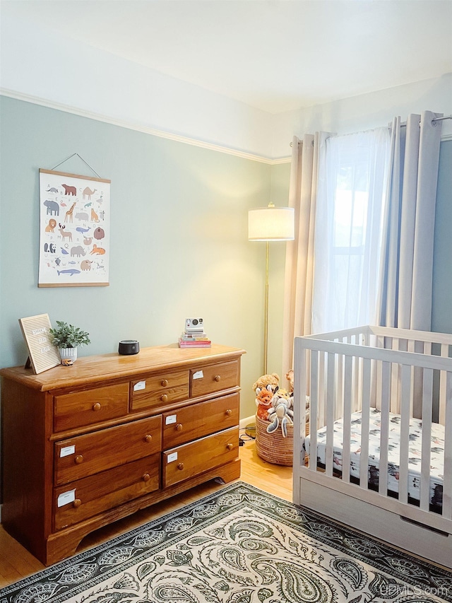 bedroom with wood-type flooring