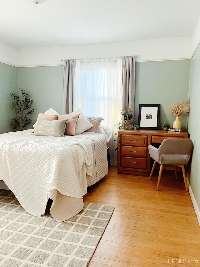 bedroom featuring hardwood / wood-style floors