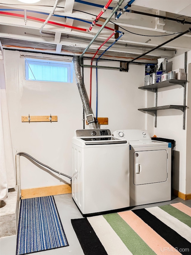 laundry room with washing machine and dryer