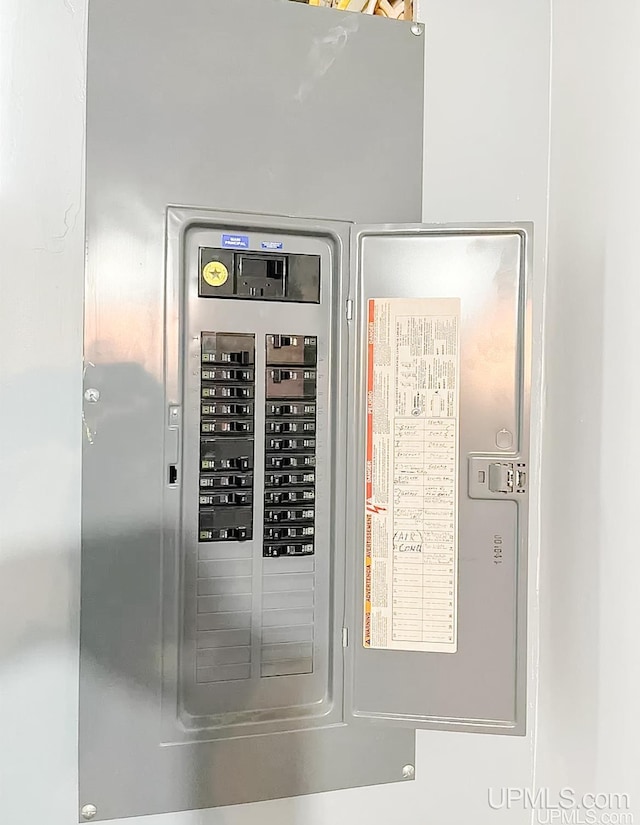 utility room featuring electric panel