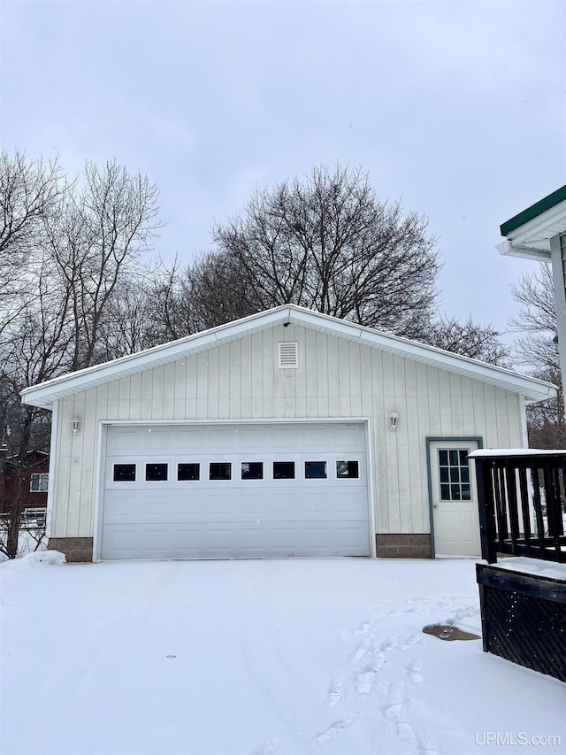 view of snow covered garage