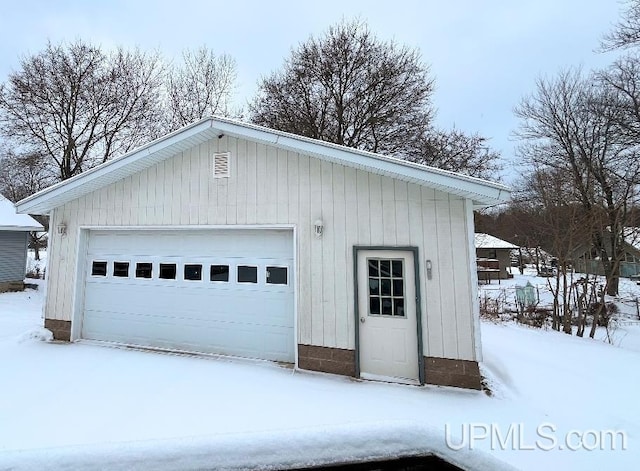 view of snow covered garage