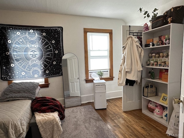 bedroom featuring wood-type flooring