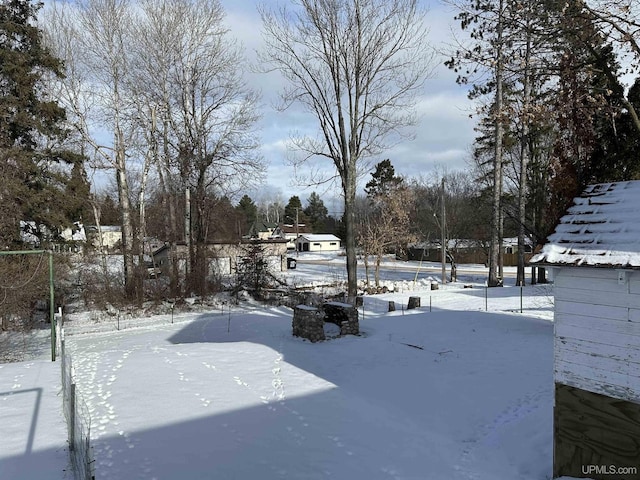 view of yard layered in snow