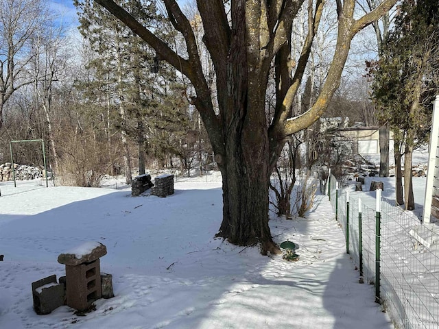 view of yard layered in snow