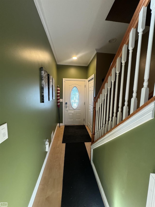 entryway featuring ornamental molding