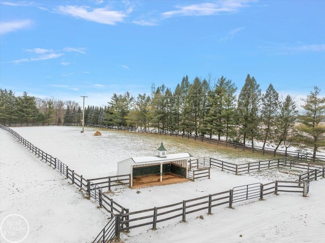 exterior space featuring a rural view and an outdoor structure