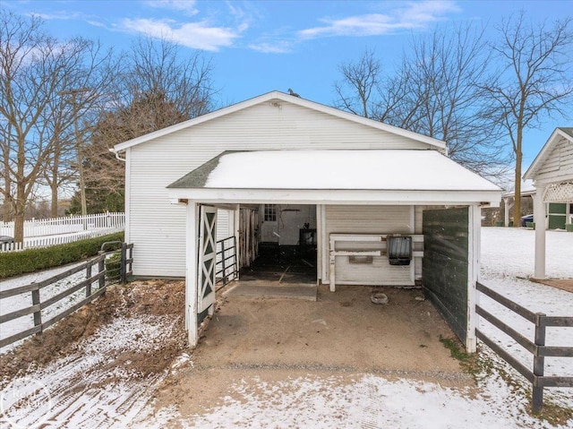 view of snow covered garage