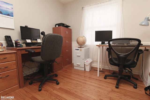 home office with light wood-type flooring