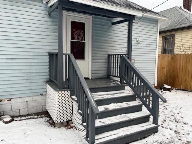 view of snow covered property entrance