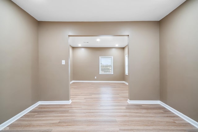 empty room with light hardwood / wood-style floors