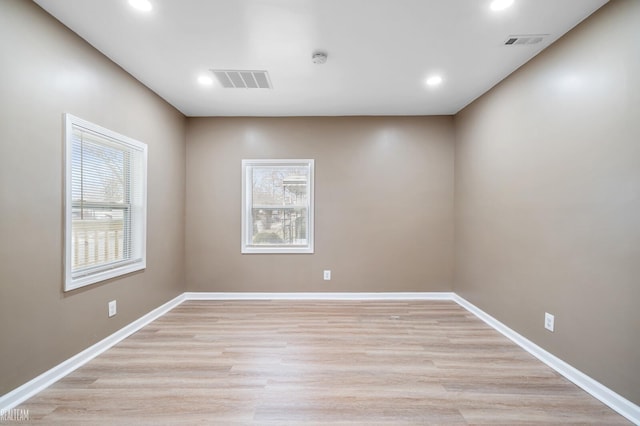 unfurnished room featuring light wood-type flooring