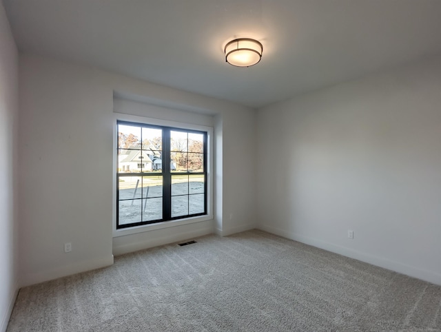 empty room with carpet flooring