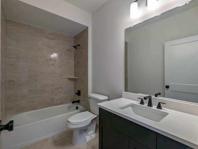 full bathroom with tile patterned flooring, vanity, tiled shower / bath combo, and toilet