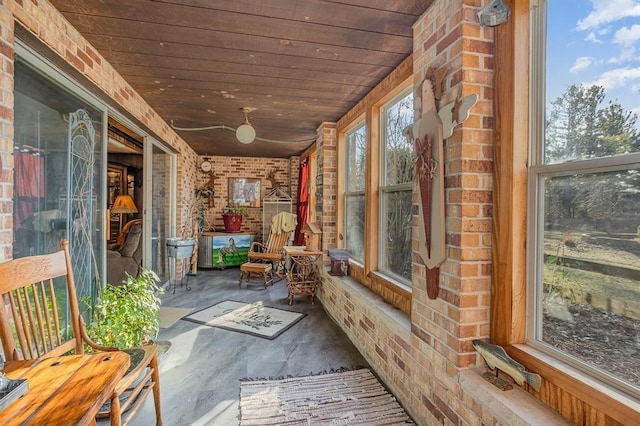 unfurnished sunroom featuring wooden ceiling