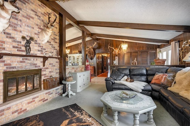 living room featuring carpet flooring, a textured ceiling, lofted ceiling with beams, a fireplace, and wood walls