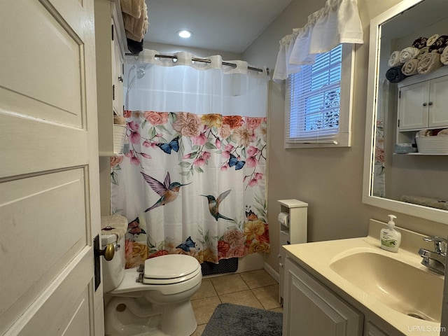 full bathroom featuring toilet, shower / bath combination with curtain, vanity, and tile patterned floors