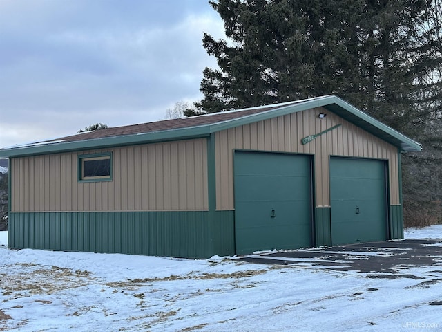 view of snow covered garage