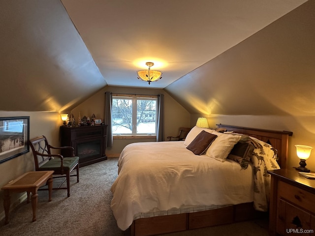 carpeted bedroom with vaulted ceiling