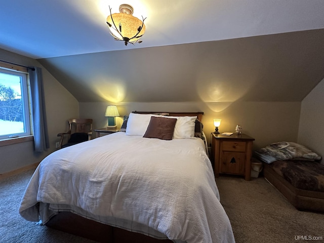 carpeted bedroom with vaulted ceiling