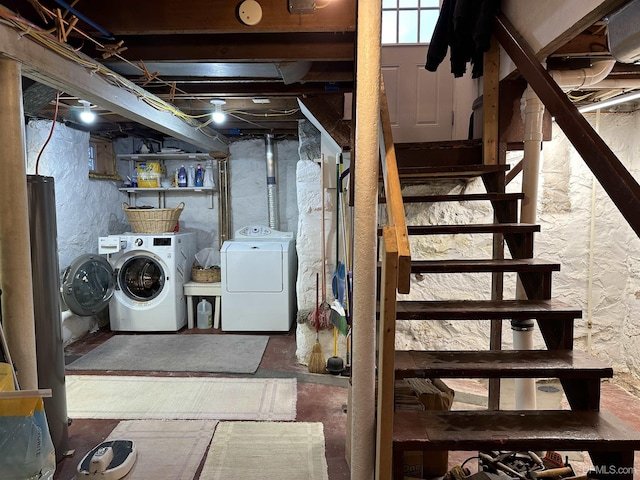 basement with washer and clothes dryer