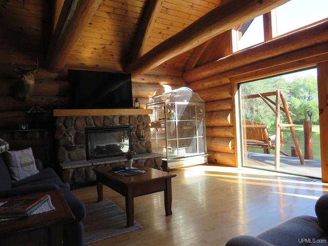 living room with beam ceiling, log walls, a stone fireplace, wood-type flooring, and wood ceiling