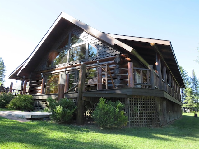 rear view of property featuring a yard