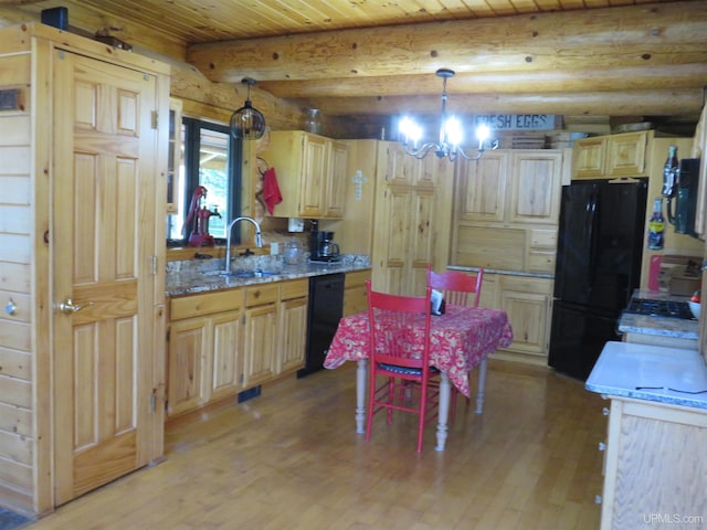 kitchen featuring an inviting chandelier, black appliances, sink, decorative light fixtures, and beam ceiling