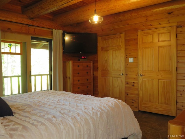 bedroom featuring beamed ceiling, wood walls, and wood ceiling