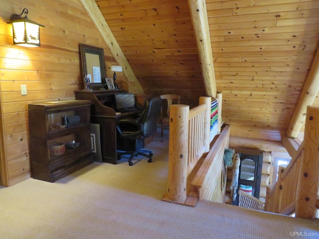 carpeted office with vaulted ceiling with beams, wooden walls, and wooden ceiling